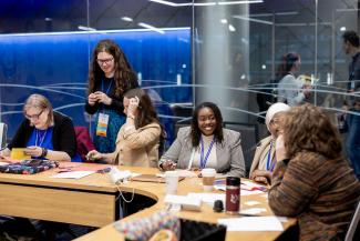 A group of smiling attendees engage in a collaborative workshop at the 2025 KYnsHIP Conference, held in the University of Kentucky Student Center Grand Ballroom on April 4th.